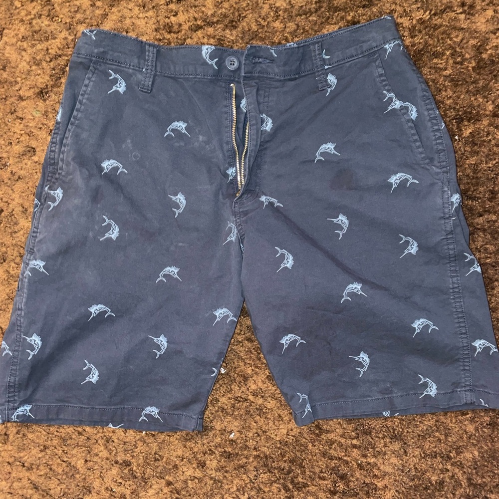 Size 32 dark blue shirts with light blue swordfish detail.